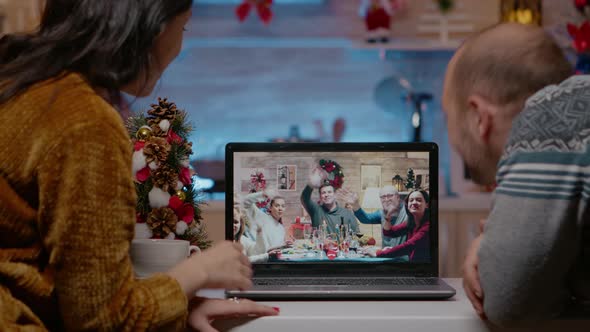 Couple Waving at Video Call Camera Talking to Family alt