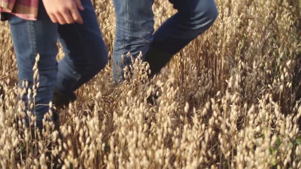 Father and Son exploring oat Field alt