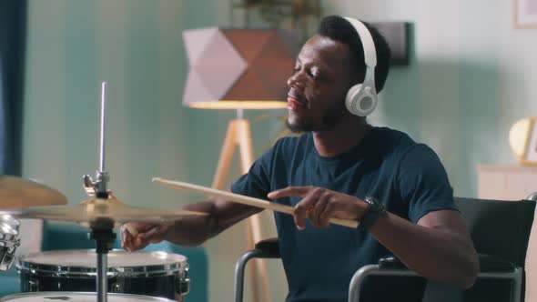 Handicapped African American Man Learning to Play Drums alt
