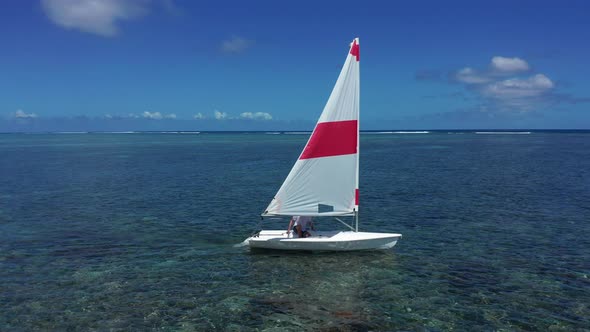 Elderly Man Sailing on Yacht at the Indian Ocean alt