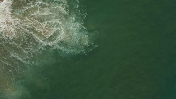 Afternoon camera down drone view from the water and waves of Redondo Beach, California. ( DJi Spark alt