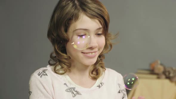 Cute Little Girl Sincerely Rejoicing to Soap Bubbles, Magic Moments of Childhood alt