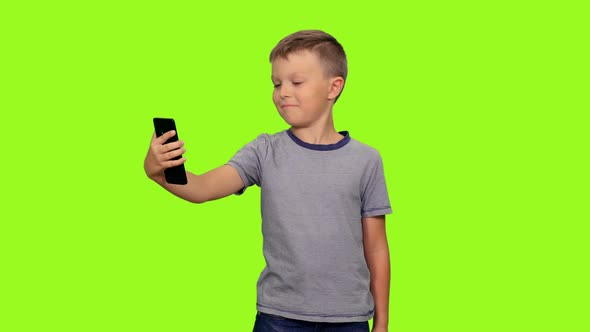 Cute Little Boy Taking Selfie With Smartphone