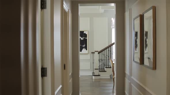 Hallway in luxury apartment building looks out to stairs alt