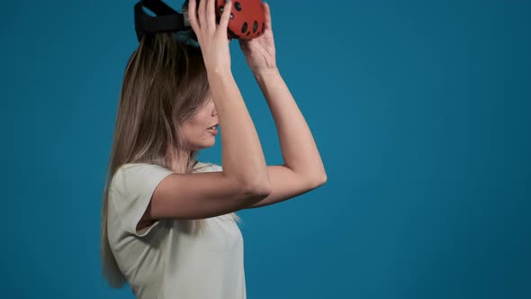 Emotional Lady Takes Off Virtual Reality Goggles alt