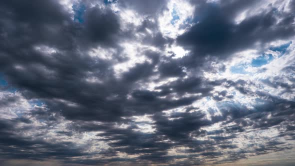 Dramatic Cumulus Cirrus Clouds Move in the Blue Sky. Sunbeams Shine. Time Lapse alt