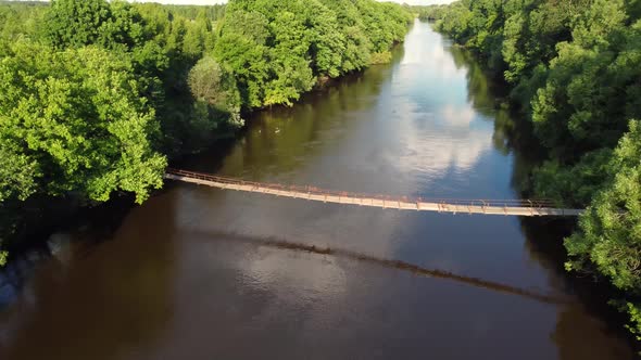 Drone Flight Over Water and Trees From a Height alt
