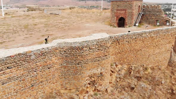Young Caucasian Girl Takes A Selfie On Top Of Historical Sightseeing Object alt