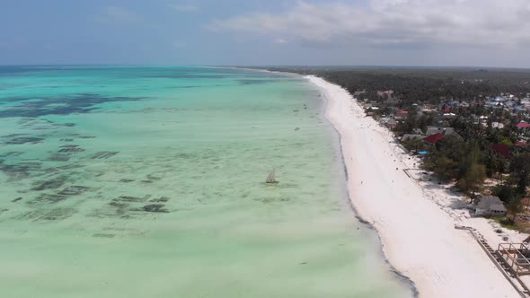 Ocean Coastline with Paradise Beach Hotels and Palm Trees Zanzibar Aerial View alt