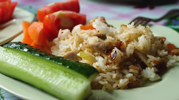 Boiled Rice with Pork Meat Sliced Cucumbers with Tomato Pieces
