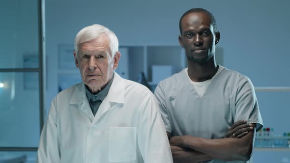 Portrait of Senior and Young Multiethnic Scientists in Lab alt