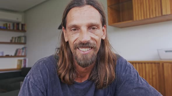 Smiling Young Man Look at Camera Talk Make Live Video Conference Call Online alt