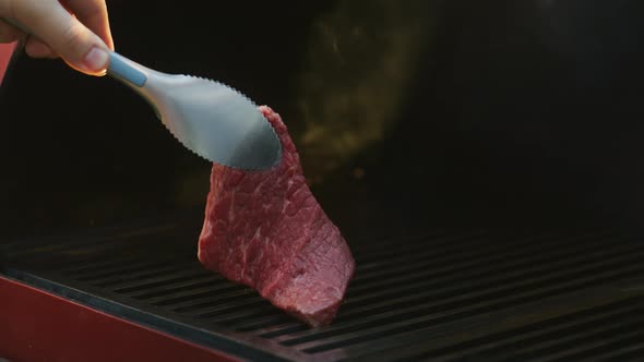 Chef Puts Meat on Grill