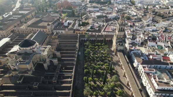 Mosque or Cathedral of Our Lady of Assumption and cityscape, Cordoba in Spain. Aerial backward