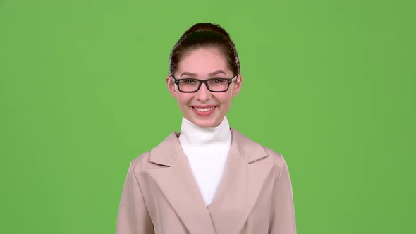 Girl in Glasses Shows Ok. Green Screen alt