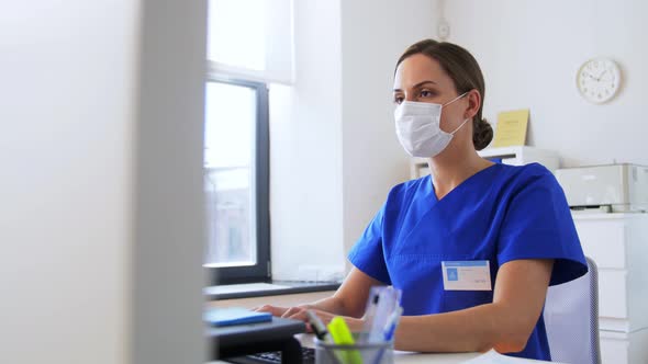 Doctor or Nurse in Mask with Computer at Hospital alt