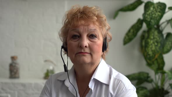 Head Shot Close Up Happy Beautiful Older Senior Woman in Eyeglasses Looking at Camera Showing alt