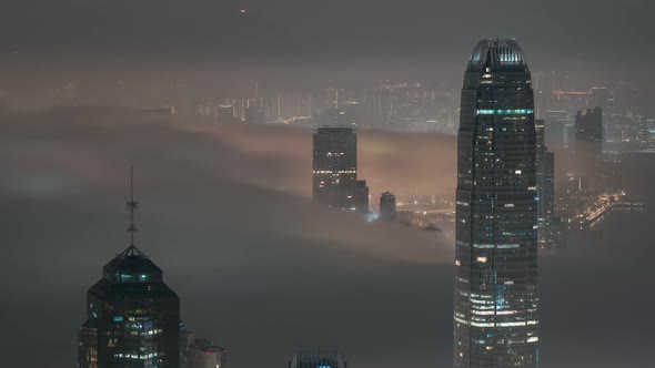 Timelapse Drone shot of the Hong Kong International Finance Centre IFC with clouds passing by the bu alt
