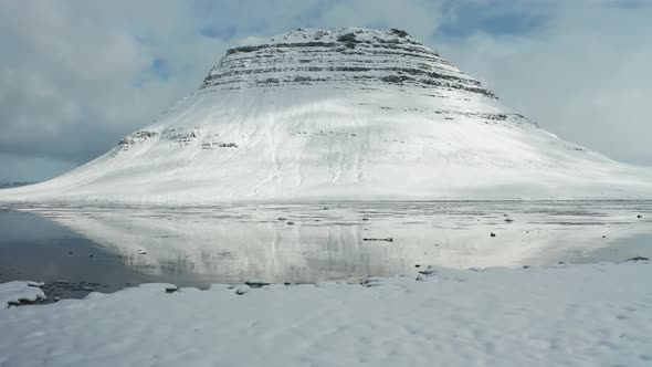 Bird's-eye View of the Snowy Mount Kirkjufetl. Iceland, Winter 2019.