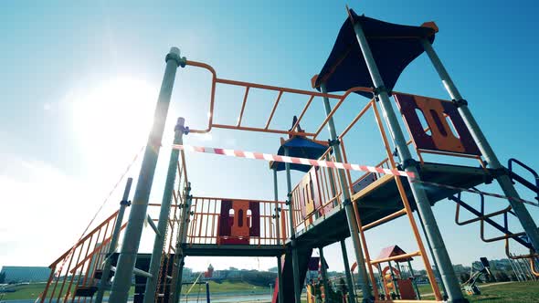 Children's Playground with a Warning Tape on It alt