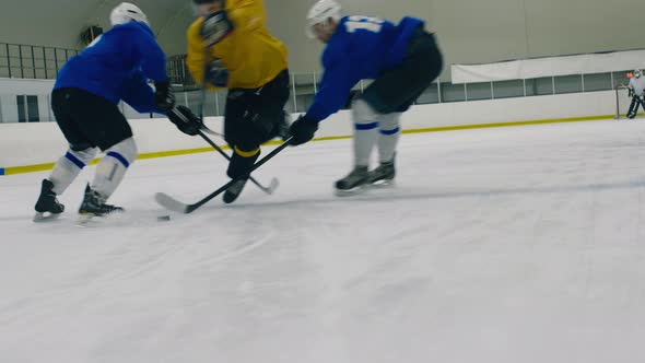 Ice hockey player falling down because of opponent's stick