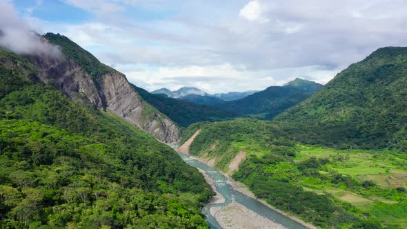 Mountains Covered By Rainforest, Aerial View. River in a Mountain Gorge. alt