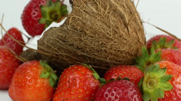 Rotating coconut strawberry. Tropical Fruit Summer Juicy Berries Tropics Bali Vegetarian