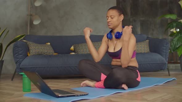Sporty Yogi Black Woman Meditating in Lotus Pose alt