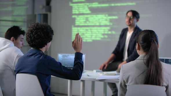 Male Student Raising Hand At IT Class alt