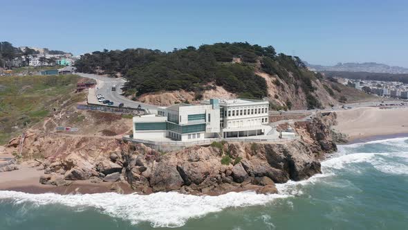 Close-up aerial panning shot of the Cliff House at Land's End in San Francisco. 4K alt