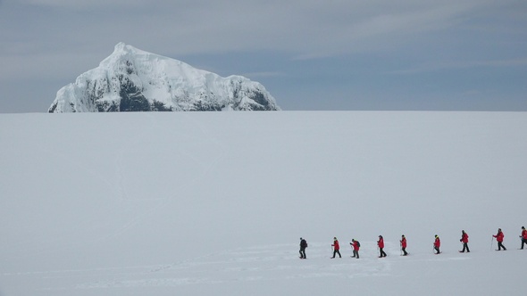 Antarctica Peninsula. People Hikers Climbing Mountain, Team Work 