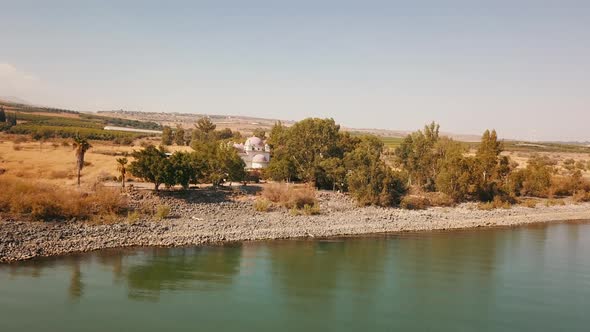 Orthodox Church of the 12 Apostles. Sea of Galilee. Capernaum. Aerial Dolly alt