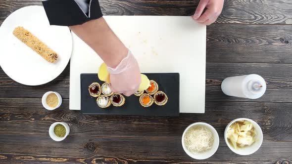 Chef Pouring Sauce Sushi alt