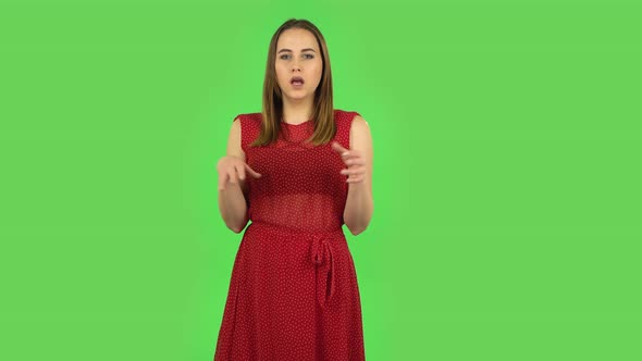 Tender Girl in Red Dress Is Clapping Her Hands Indifferent. Green Screen alt