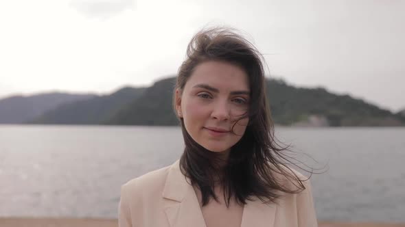 Portrait of the beautiful successful woman laughing. Caucasian female on vacation seaside alt