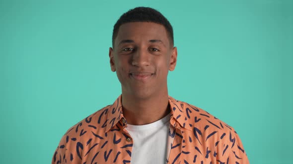 Young African American Man Smiling on Camera alt