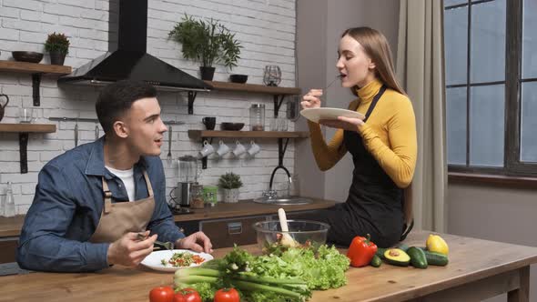 Making Salad at Home Young Vegetarians Chewing Tasty Organic Salad alt