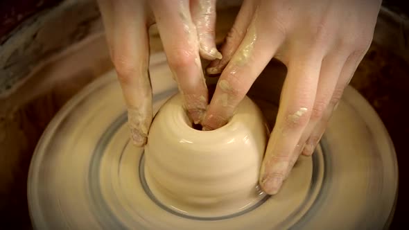 The Sculptor in the Workshop Makes a Jug Out of Earthenware Closeup alt