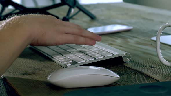 A Caucasian Male Typing on a Wireless Keyboard 08 alt