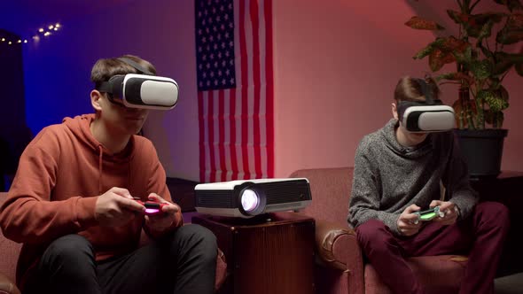 Young Men in Headsets Playing Virtual Videogame Together