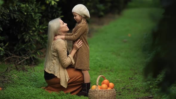 Mom and Daughter in the Garden Tangerine