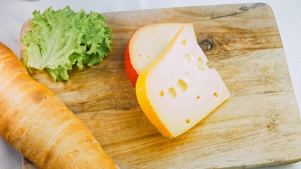 Cheese with Holes on a Retrostyle Cooking Tray alt