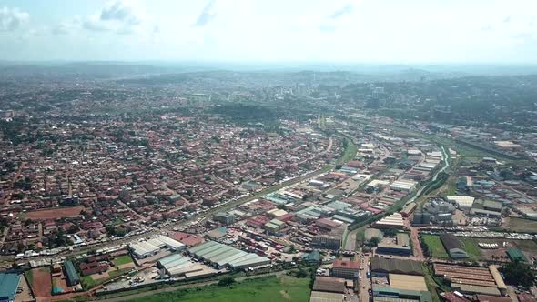 Aerial view of densely populated area and industrial zone in Kampala, Uganda. alt