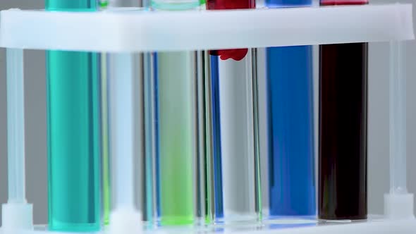 Close Up of Test Tubes with Colorful Liquid alt