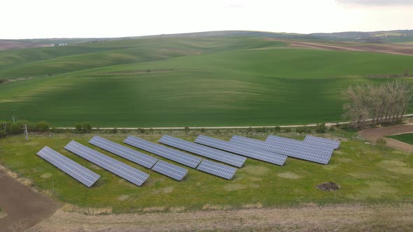 Aerial drone view into large solar panels at a solar farm. Solar cell power plants. footage video 4k alt
