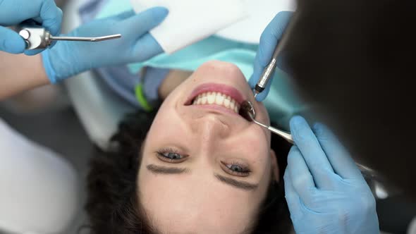 Pretty Woman's Teeth Treatment in Dental Clinic