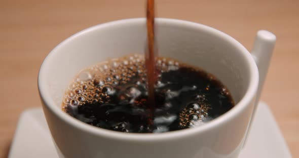 Coffee cup pouring close up 4K
