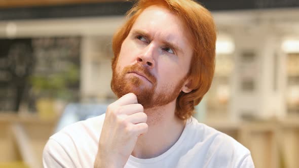 Portrait of Thinking Redhead Beard Man in Cafe, Brainstorming alt