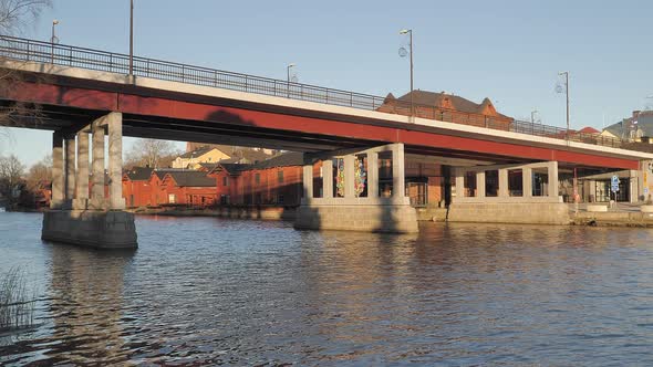 Closer Shot of the Porvoo River and the Bridge Crossing It in Finland alt