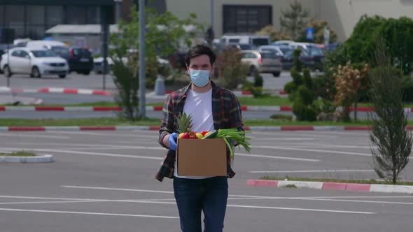 Volunteer person carring fresh vegetables from supermarket store in time of epidemic outbreak